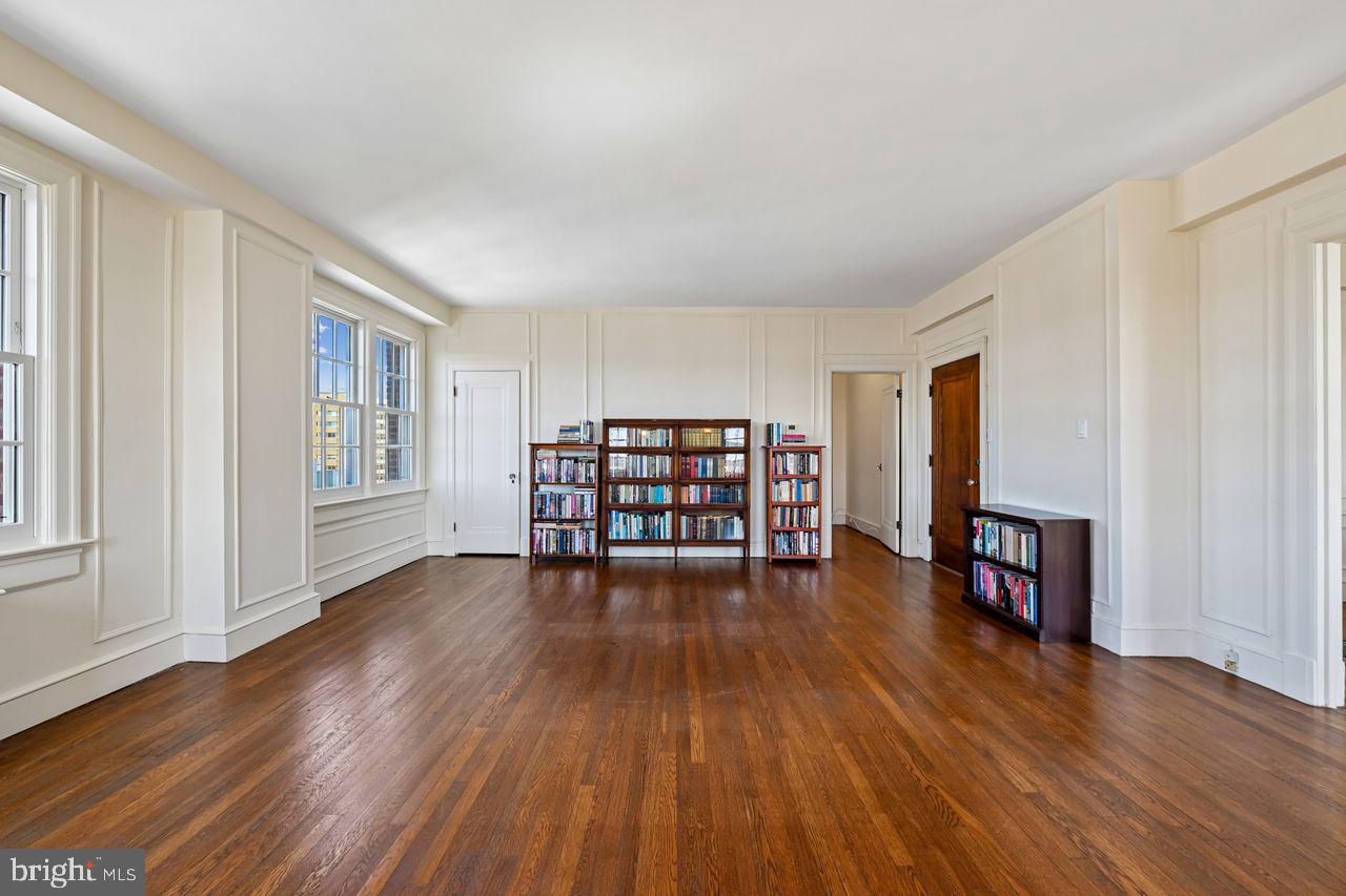 1661 Crescent Place Northwest, Unit 502 Washington, DC 20009 - Photo 5 of 50 a living room with furniture and a wooden floor