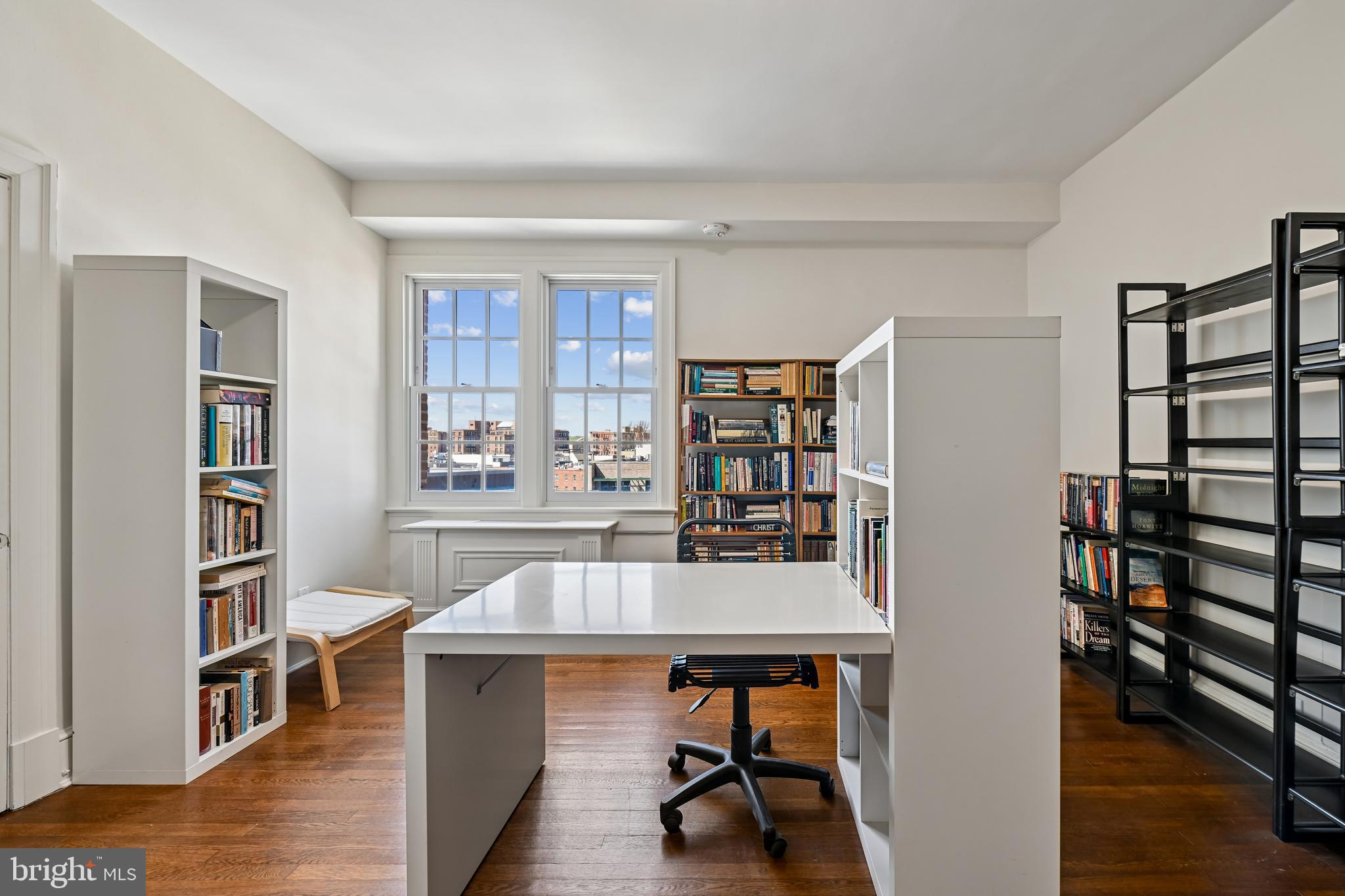 1661 Crescent Place Northwest, Unit 502 Washington, DC 20009 - Photo 8 of 50 a workspace with furniture window and wooden floor
