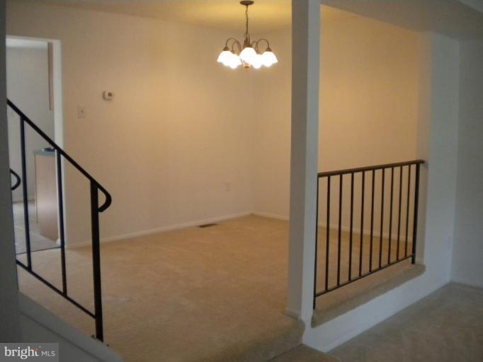 step up dining room w/ new paint, light , carpet