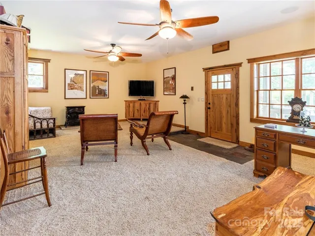a view of a swimming pool and trees in the background