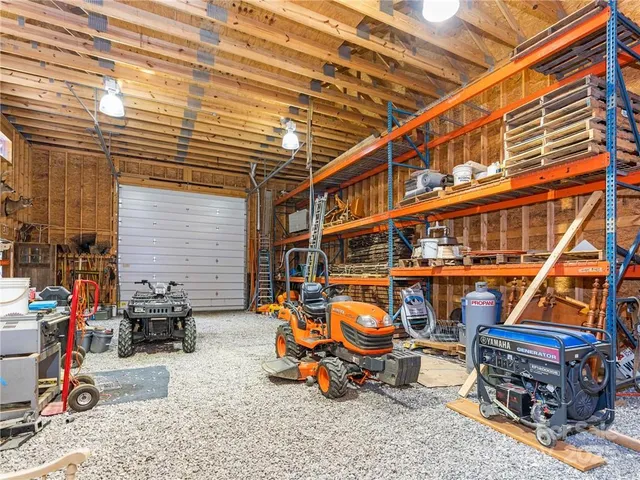 a backyard of a house with lots of green space and chair