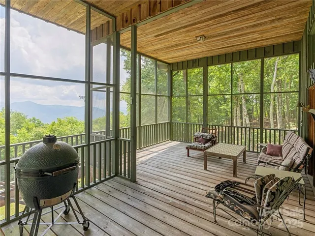 a dining room with wooden floor a chandelier a wooden table and chairs