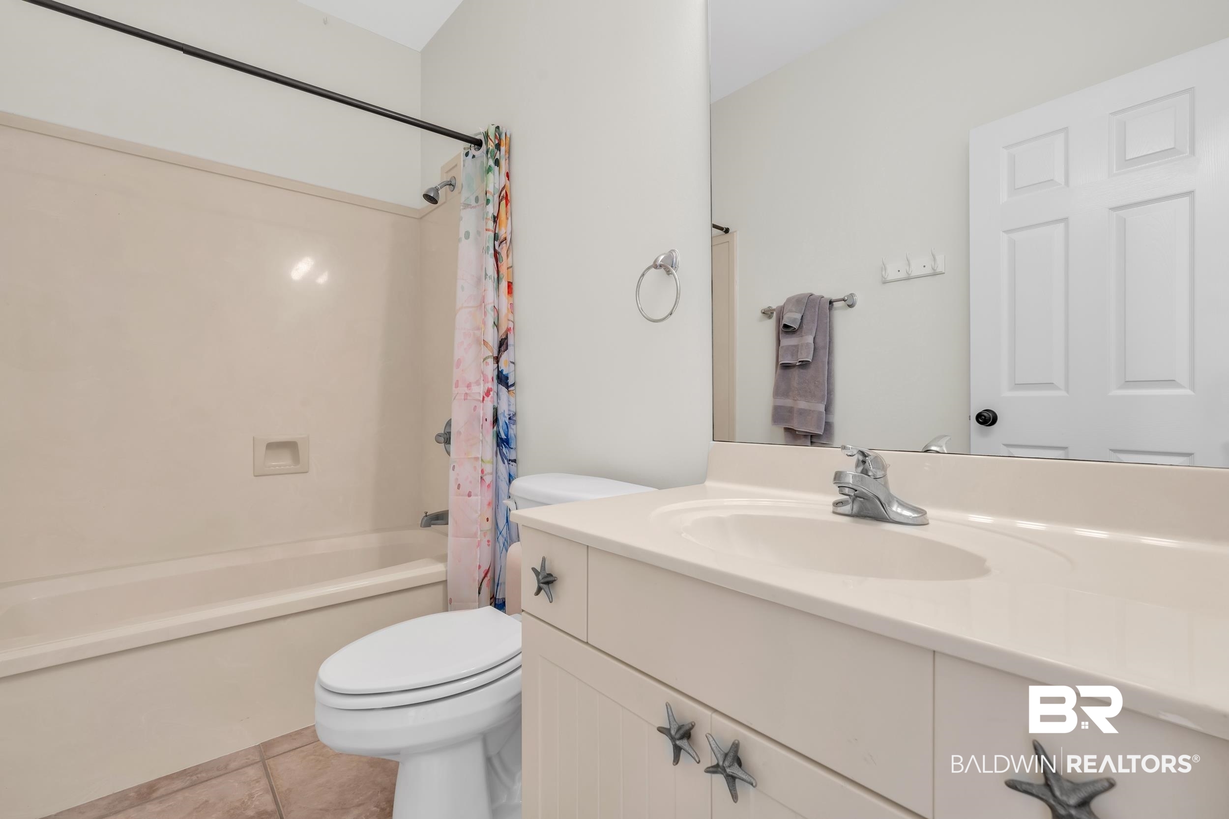 4606 Osprey Drive Orange Beach, AL 36561 - Photo 34 of 44 Full bathroom featuring vanity, tile patterned flooring, and shower / bathtub combination