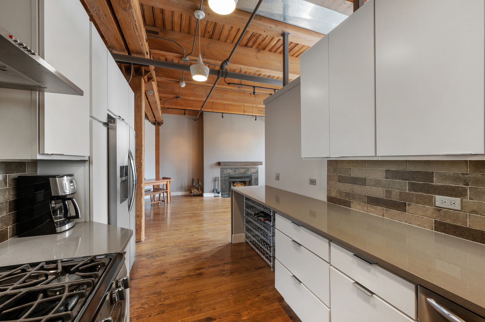 400 South Green Street, Unit 406 Chicago, IL 60607 - Photo 11 of 19 a kitchen with stainless steel appliances granite countertop a sink a stove and cabinets
