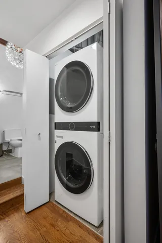 a view of a hallway with washer and dryer