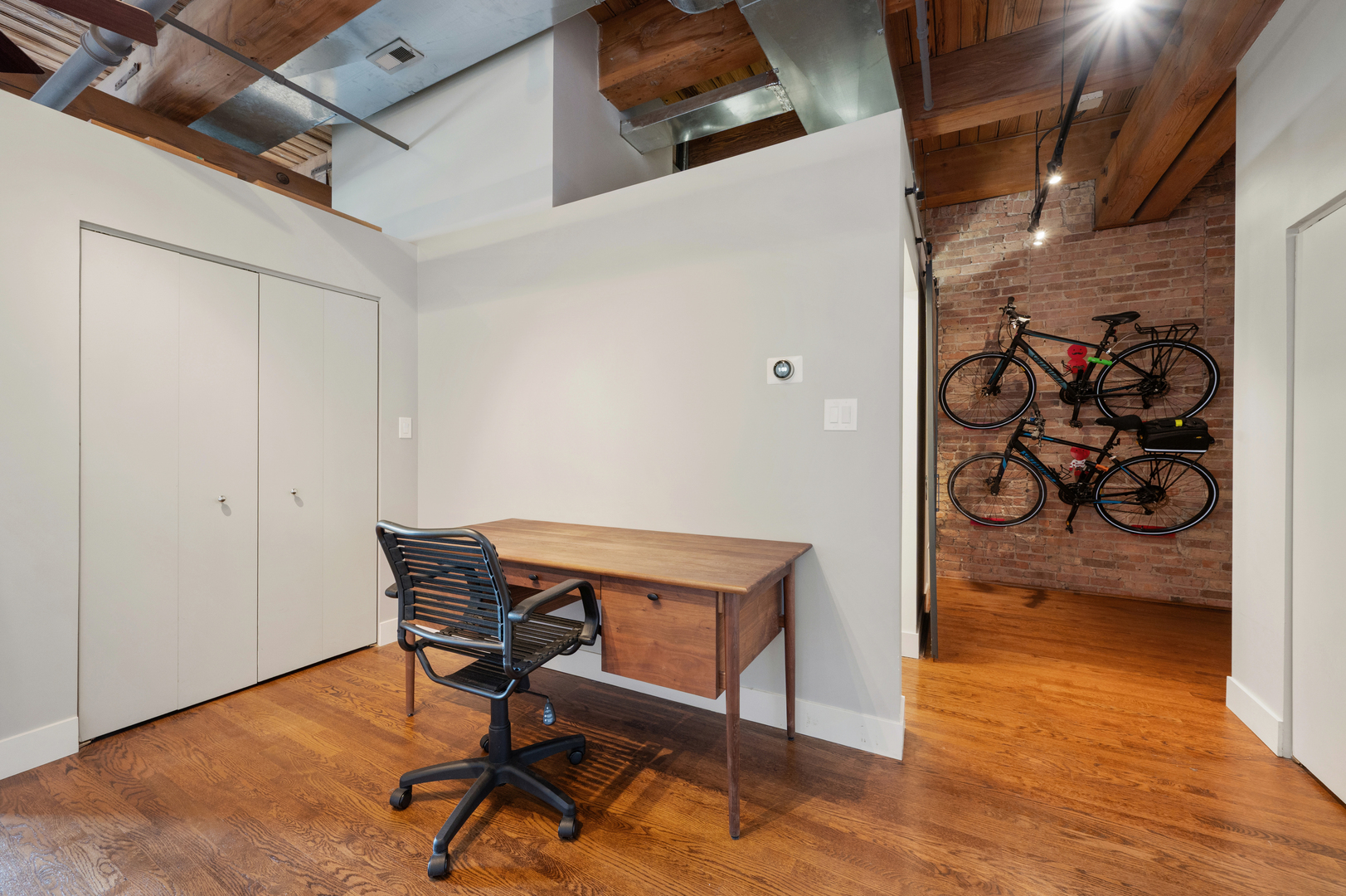 400 South Green Street, Unit 406 Chicago, IL 60607 - Photo 3 of 19 a view of a room with wooden floor and a rug