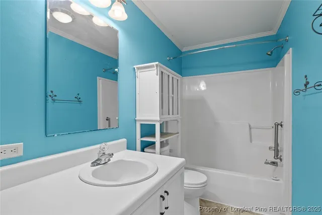 a view of an empty room with a bathroom