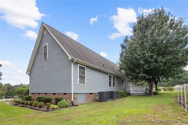 front view of a house with a tree