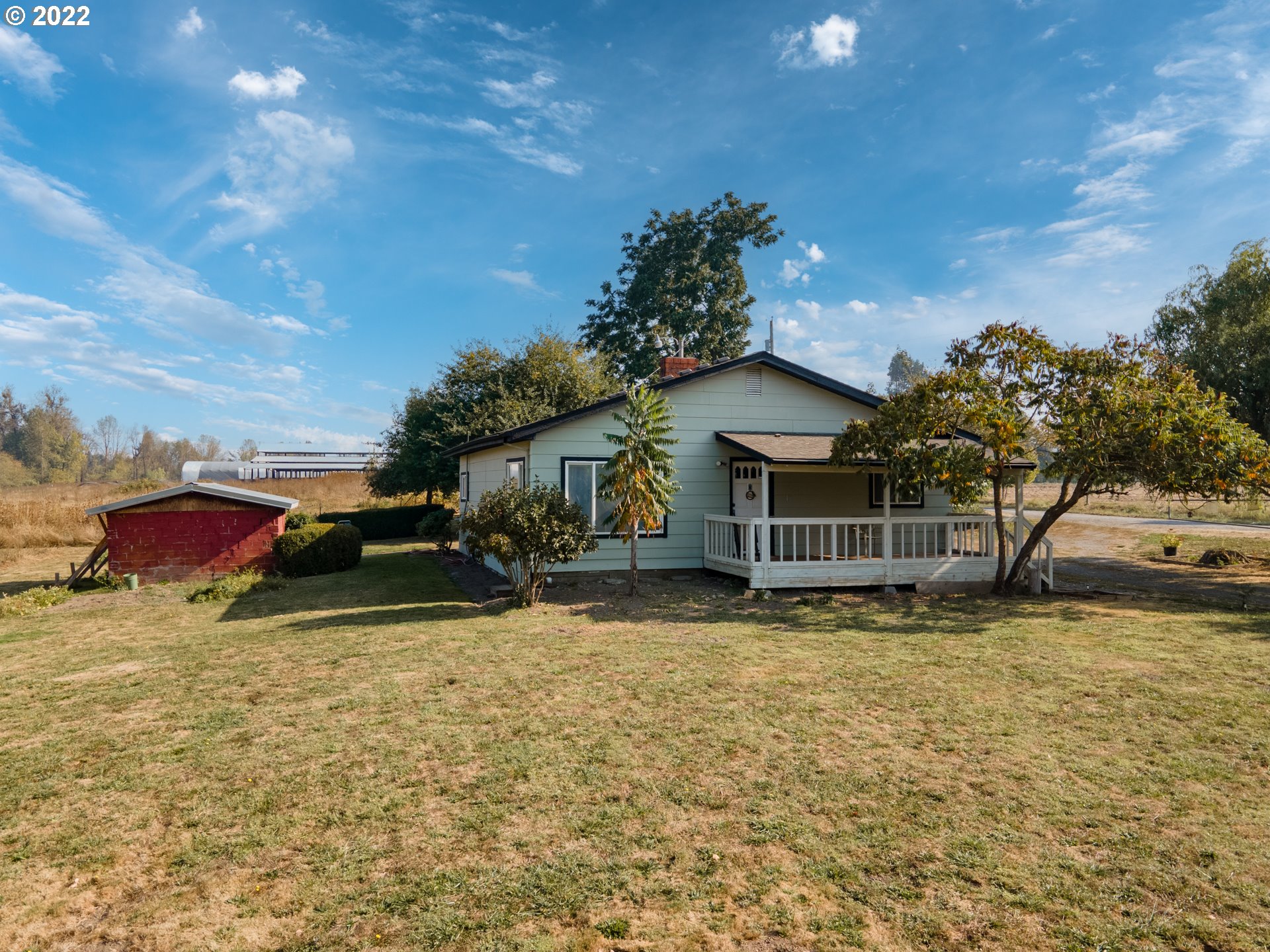 22902 Schultz Road Northeast Aurora, OR 97002 - Photo 6 of 20 a view of a house with a yard and sitting area