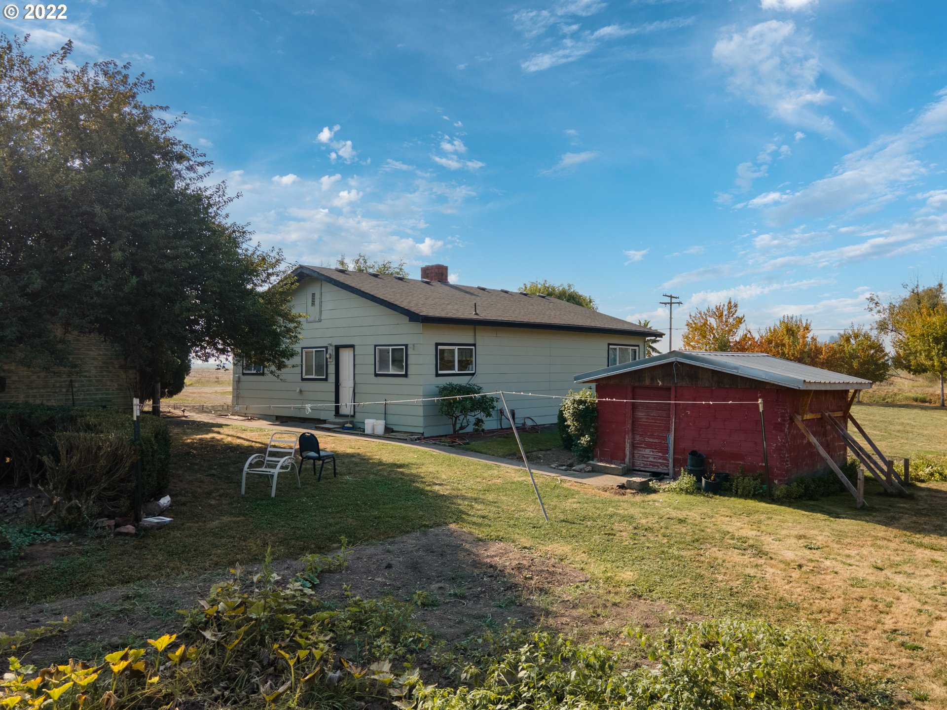 22902 Schultz Road Northeast Aurora, OR 97002 - Photo 7 of 20 a view of a house with backyard and sitting area