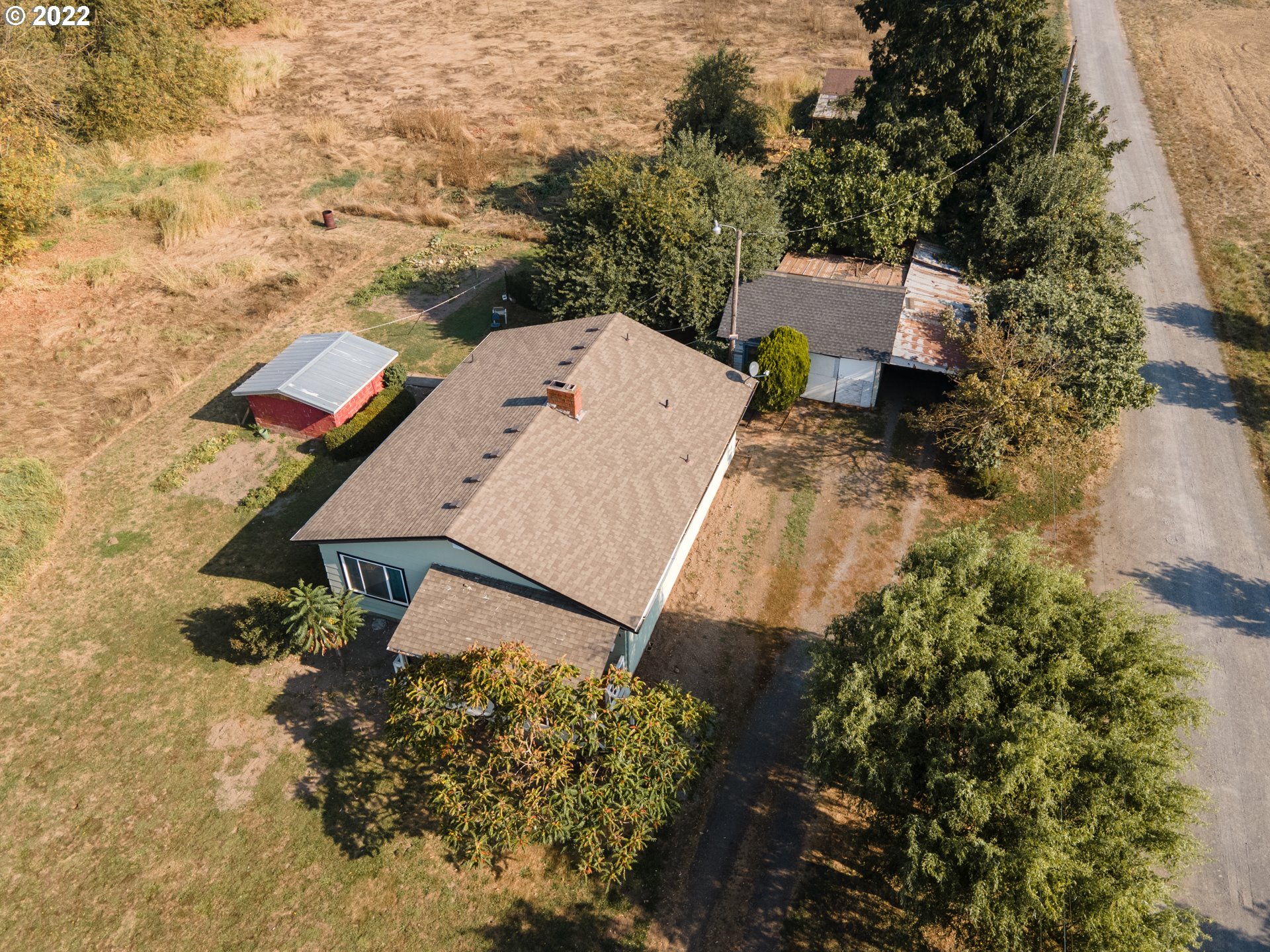 22902 Schultz Road Northeast Aurora, OR 97002 - Photo 10 of 20 an aerial view of a house with a yard and trees