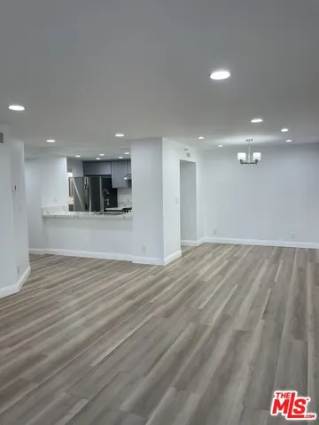a view of a kitchen with a sink and a microwave