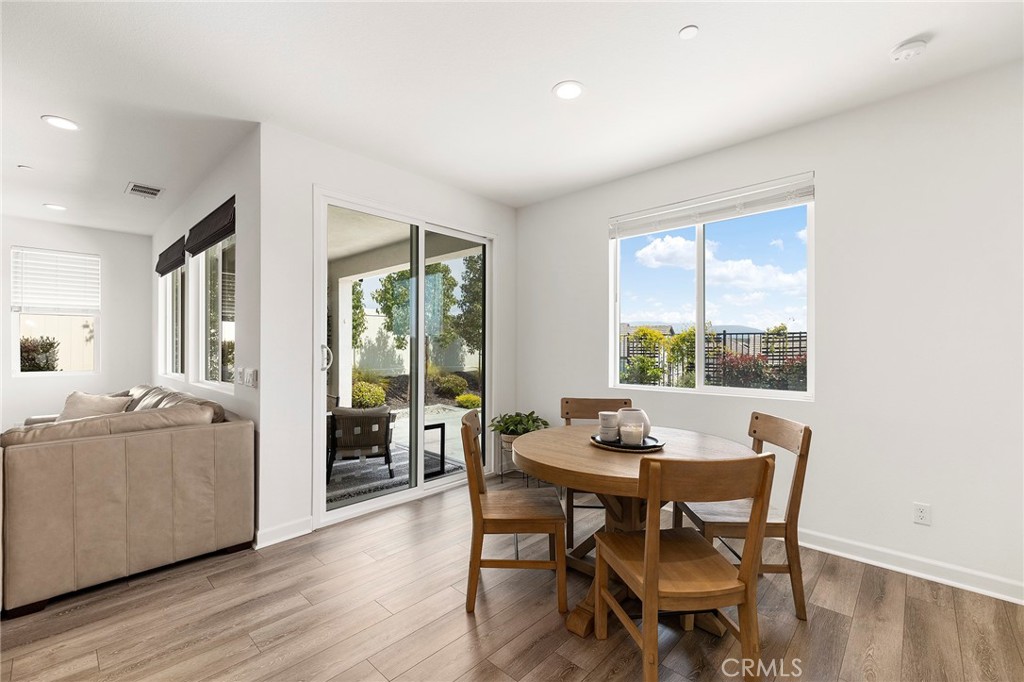 32151 Everview Terrace Temecula, CA 92591 - Photo 13 of 39 a dining room with furniture and wooden floor