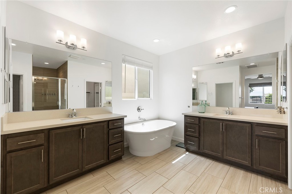 32151 Everview Terrace Temecula, CA 92591 - Photo 17 of 39 a spacious bathroom with a double vanity sink mirror and bathtub