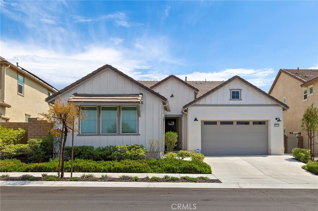 32151 Everview Terrace Temecula, CA 92591 - Photo 2 of 39 a front view of a house with a yard and garage