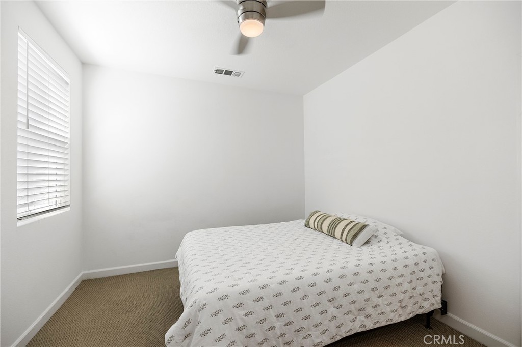 32151 Everview Terrace Temecula, CA 92591 - Photo 21 of 39 a bedroom with a bed and window