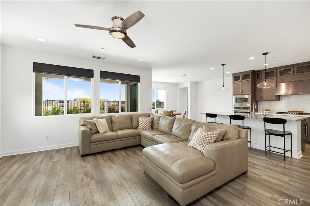 32151 Everview Terrace Temecula, CA 92591 - Photo 9 of 39 a living room with furniture or kitchen view and a large window