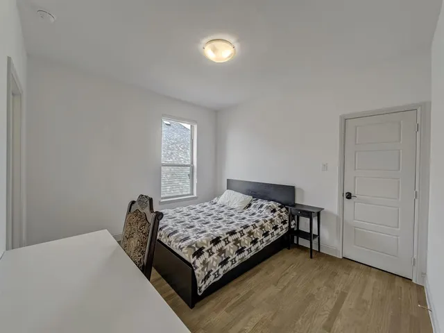 a view of staircase with white walls and railing