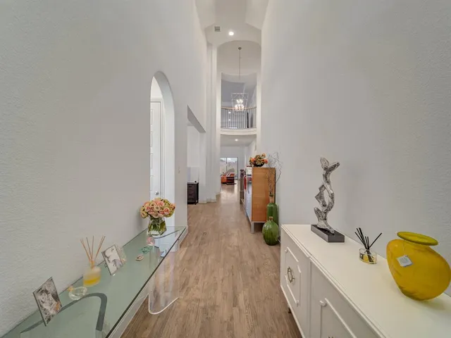 a spacious bathroom with a granite countertop sink and a mirror