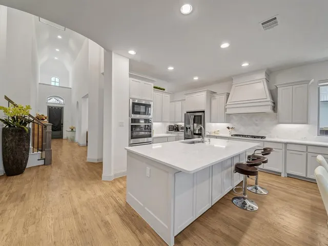 a kitchen with counter top space and appliances