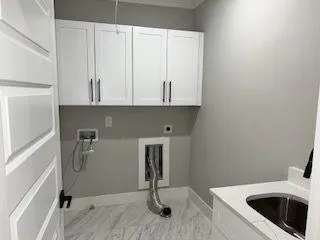 a kitchen with a sink and cabinets