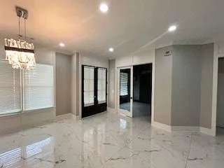 a view of a hallway with wooden shelves