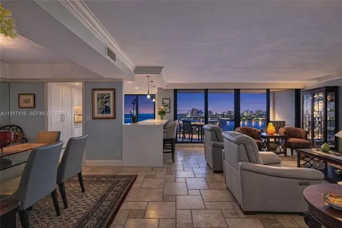 a view of a balcony with wooden floor and outdoor seating