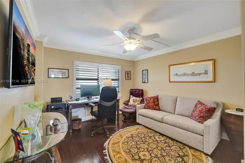 a view of a lake with a table and chairs