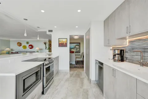 a balcony with chairs and table