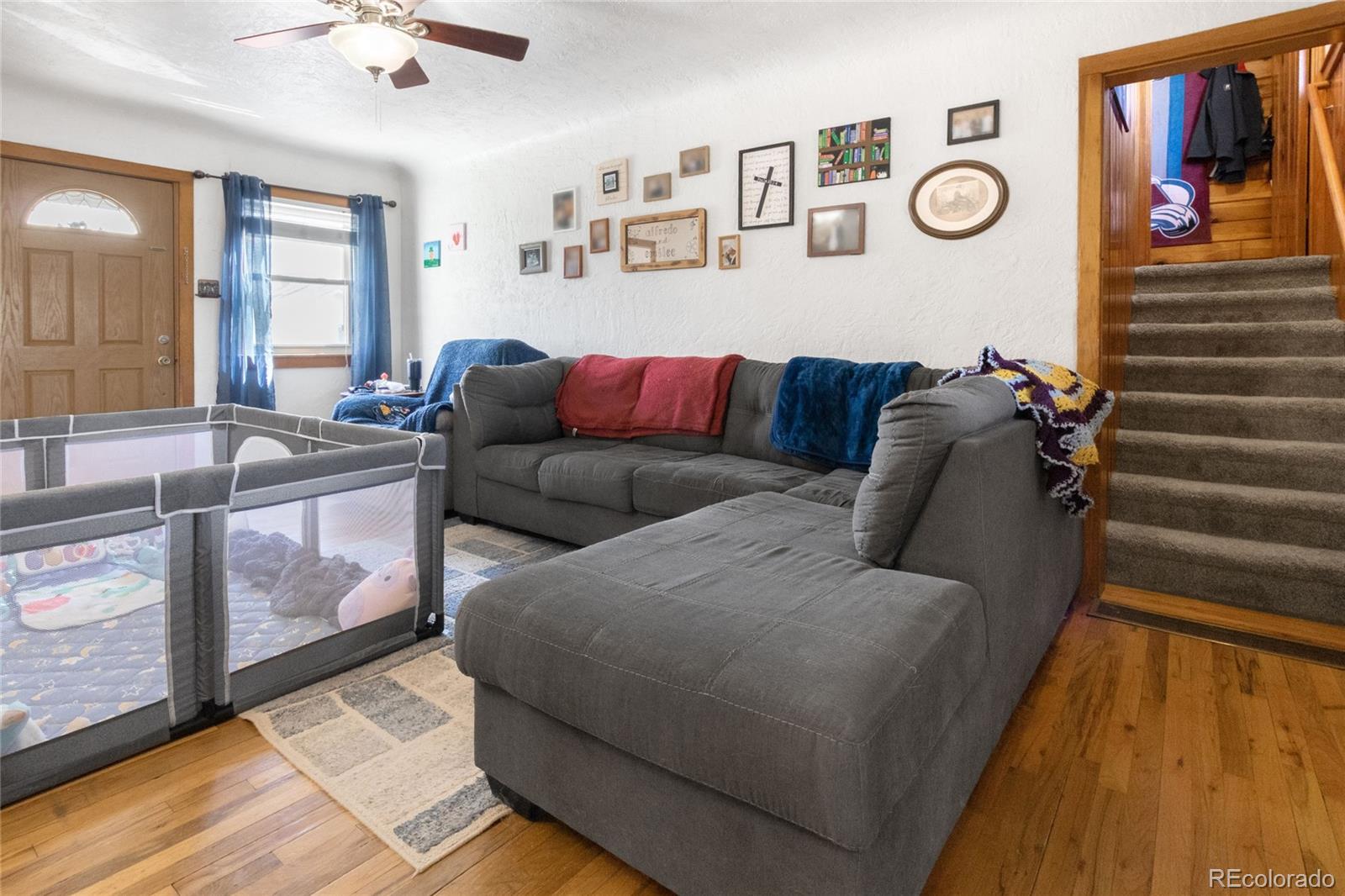 229 4th Street Fort Lupton, CO 80621 - Photo 14 of 25 a living room with furniture and window
