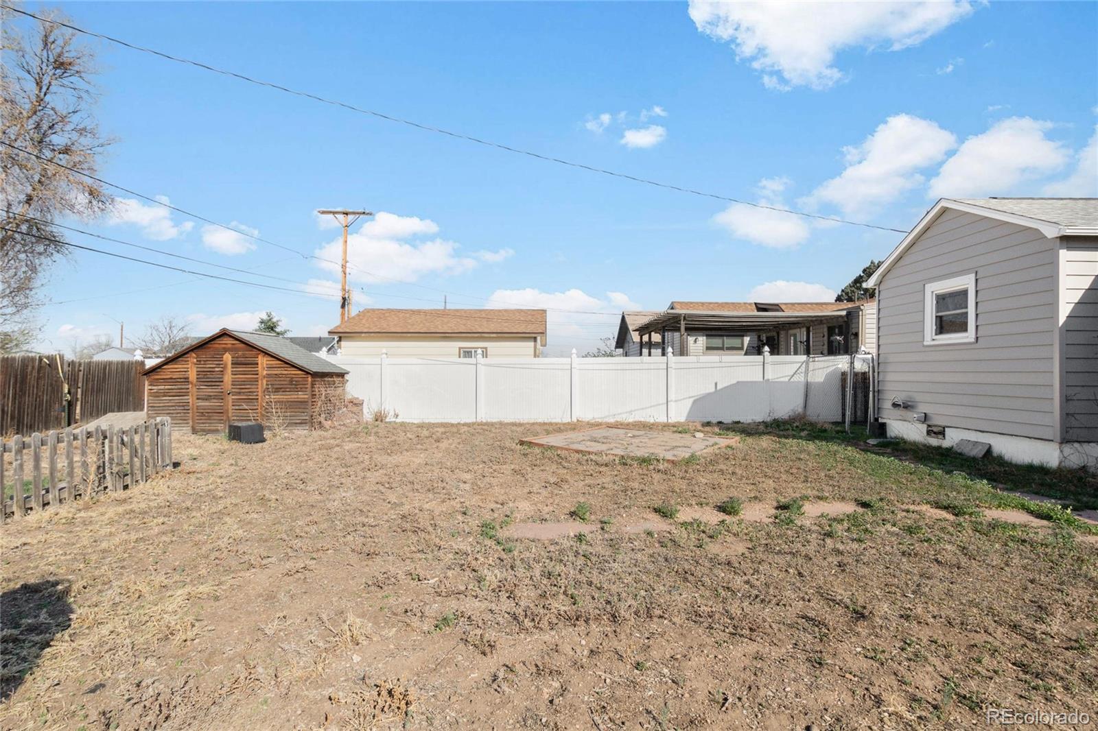 229 4th Street Fort Lupton, CO 80621 - Photo 24 of 25 a view of a house with a snow in the background