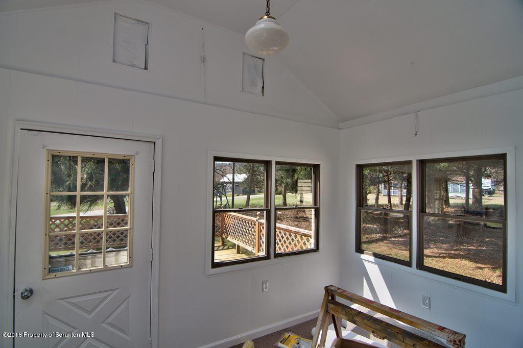 3585 Hornbaker Cemetary Road Moscow, PA 18444 - Photo 2 of 46 a view of an empty room with windows