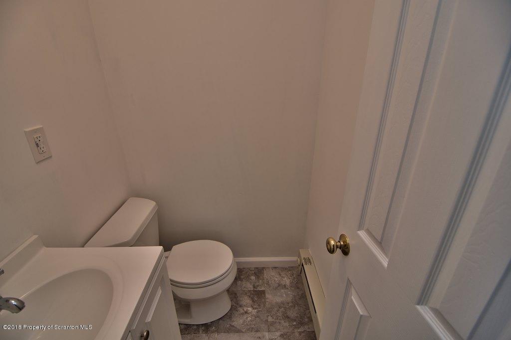 3585 Hornbaker Cemetary Road Moscow, PA 18444 - Photo 29 of 46 a white toilet sitting next to a white sink
