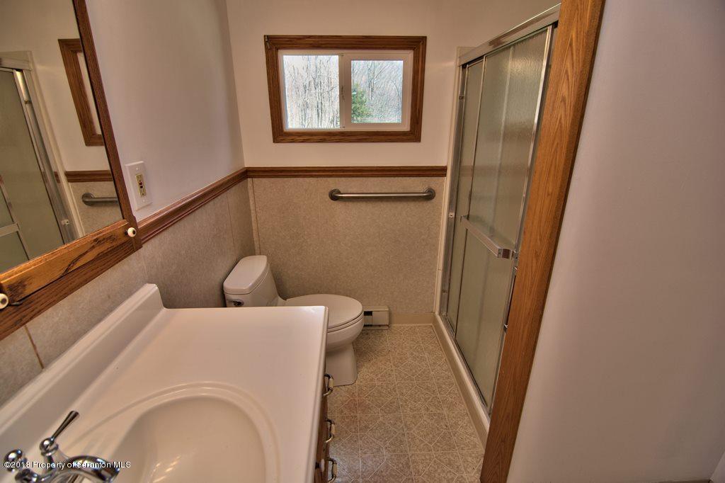 3585 Hornbaker Cemetary Road Moscow, PA 18444 - Photo 32 of 46 a bathroom with a sink and toilet