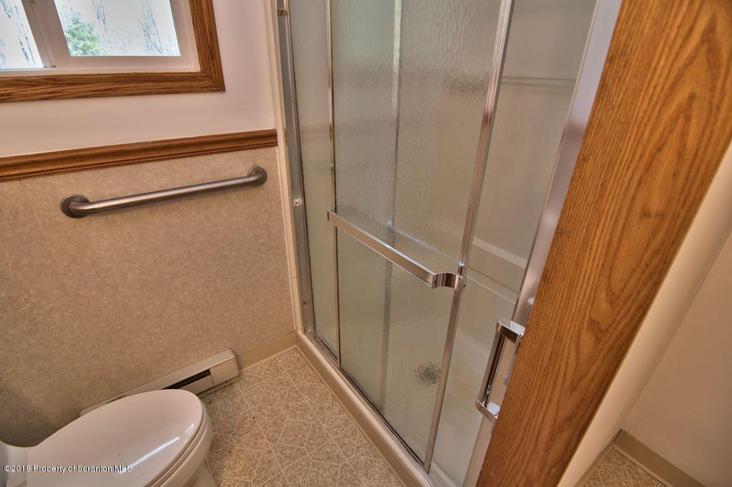 3585 Hornbaker Cemetary Road Moscow, PA 18444 - Photo 33 of 46 a bathroom with a toilet and a sink