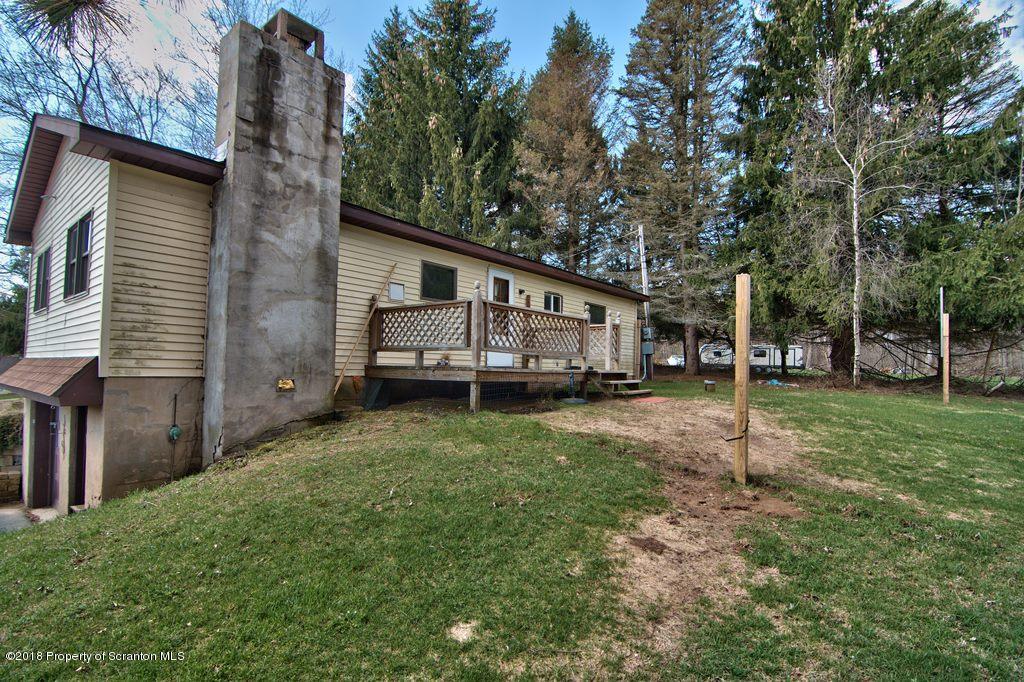 3585 Hornbaker Cemetary Road Moscow, PA 18444 - Photo 38 of 46 a view of a house with backyard and trees