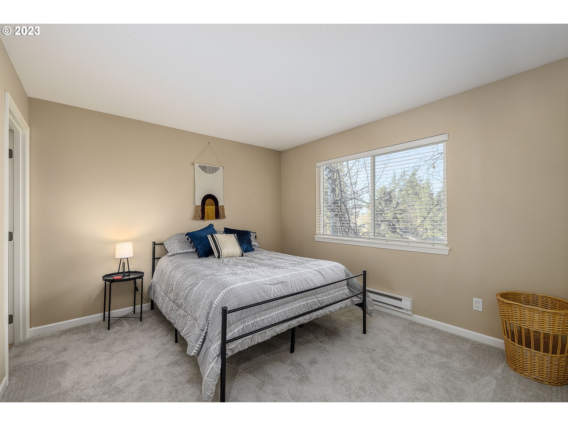 10178 Southeast Talbert Street Clackamas, OR 97015 - Photo 18 of 32 a bedroom with a bed and a window