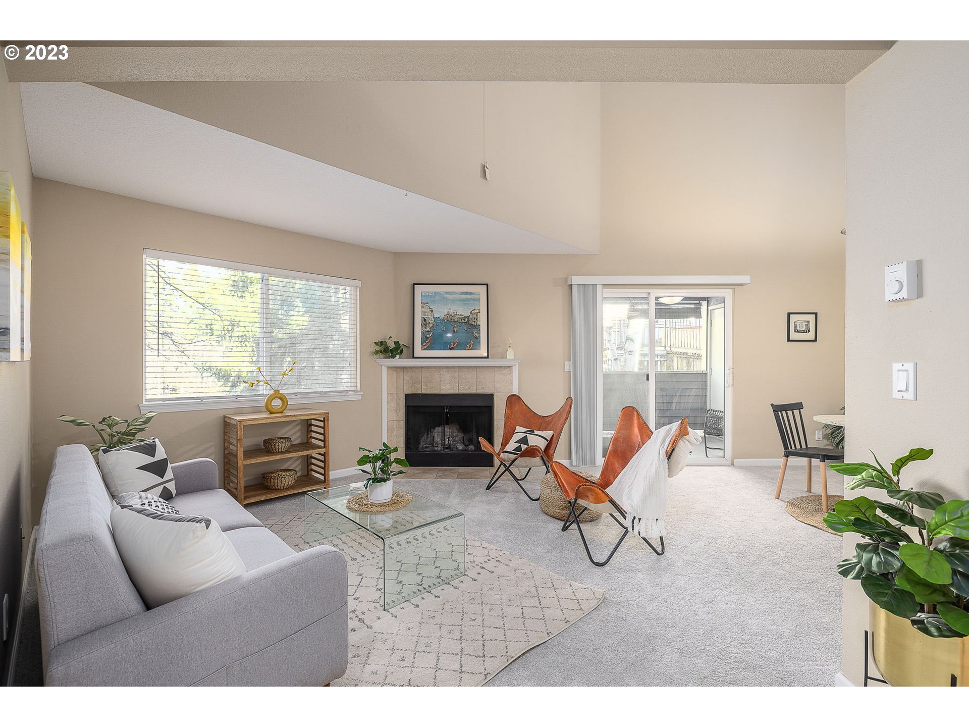 10178 Southeast Talbert Street Clackamas, OR 97015 - Photo 5 of 32 a living room with furniture a fireplace and a table