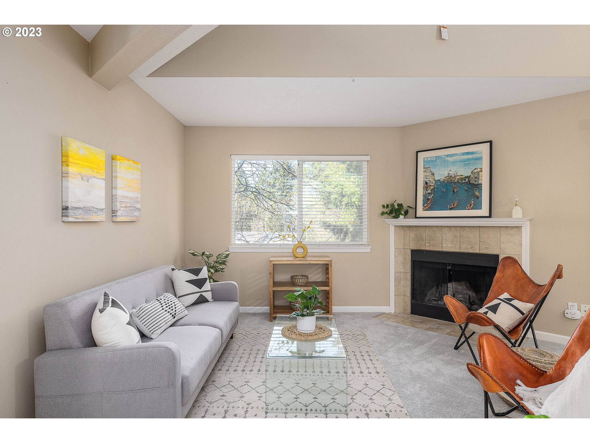 10178 Southeast Talbert Street Clackamas, OR 97015 - Photo 7 of 32 a living room with furniture a fireplace and a large window