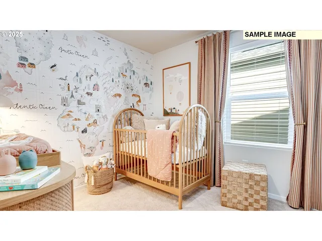 a view of a bedroom with a bed and table