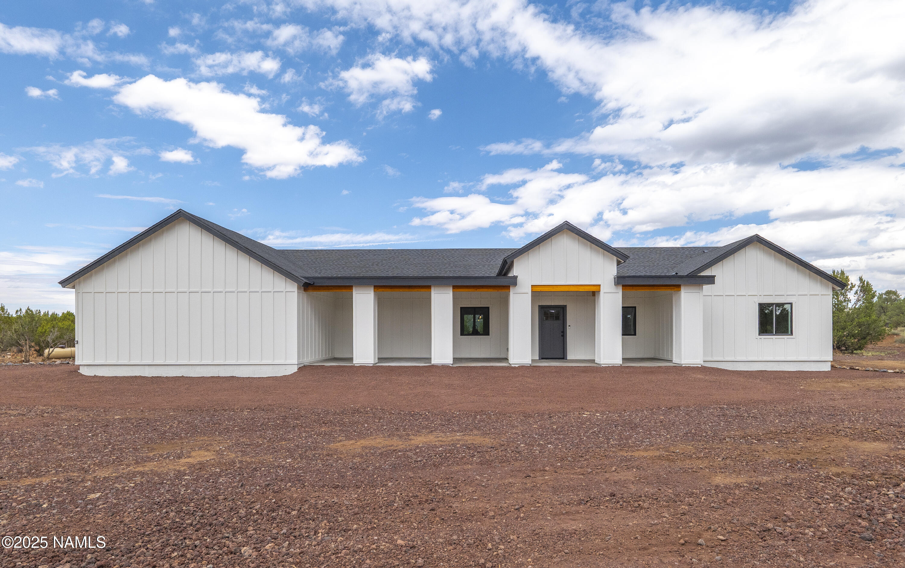 7935 North Red Lake Road Williams, AZ 86046 - Photo 1 of 31 a view of a house with a yard and garage
