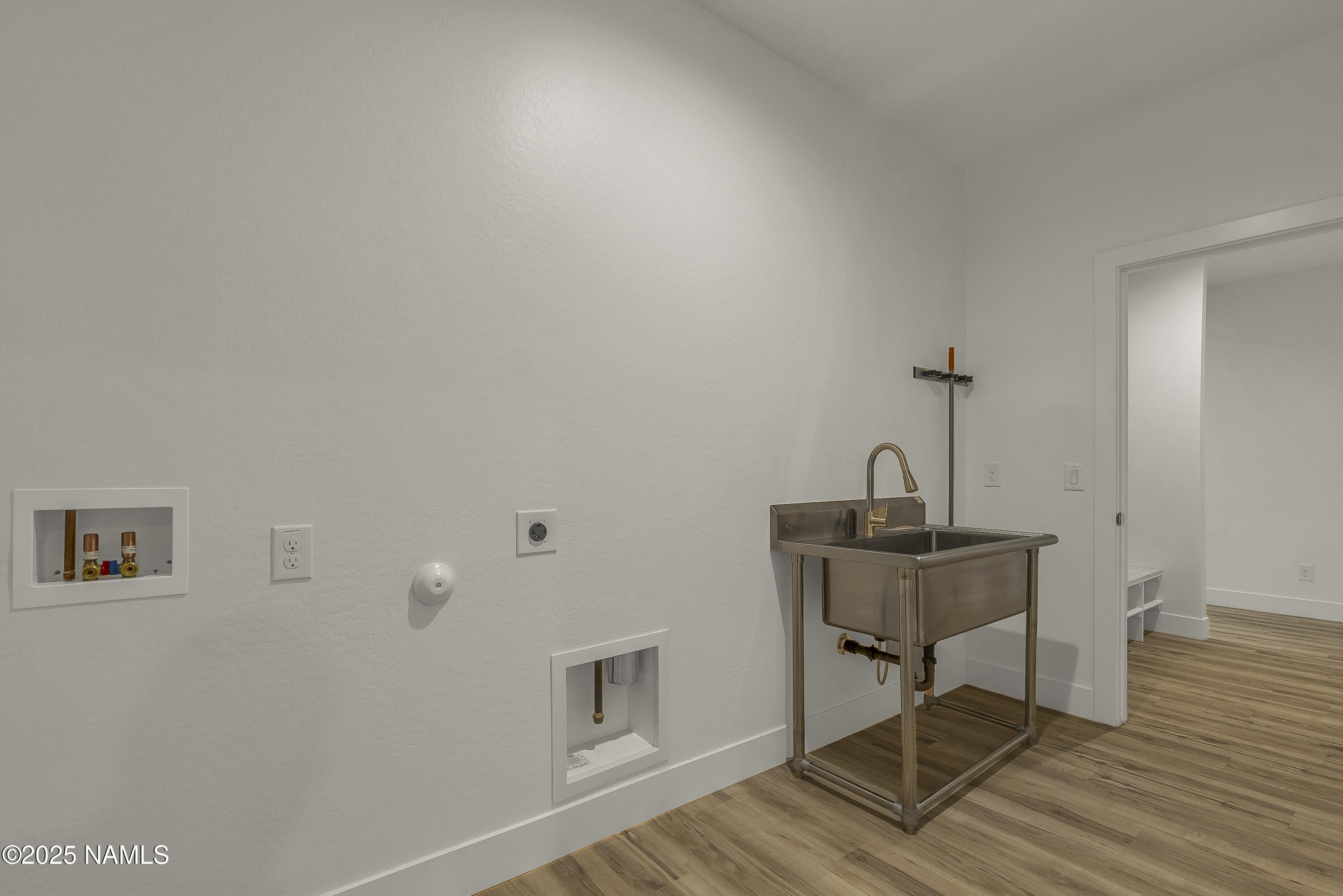 7935 North Red Lake Road Williams, AZ 86046 - Photo 12 of 31 a view of a workspace with furniture and wooden floor