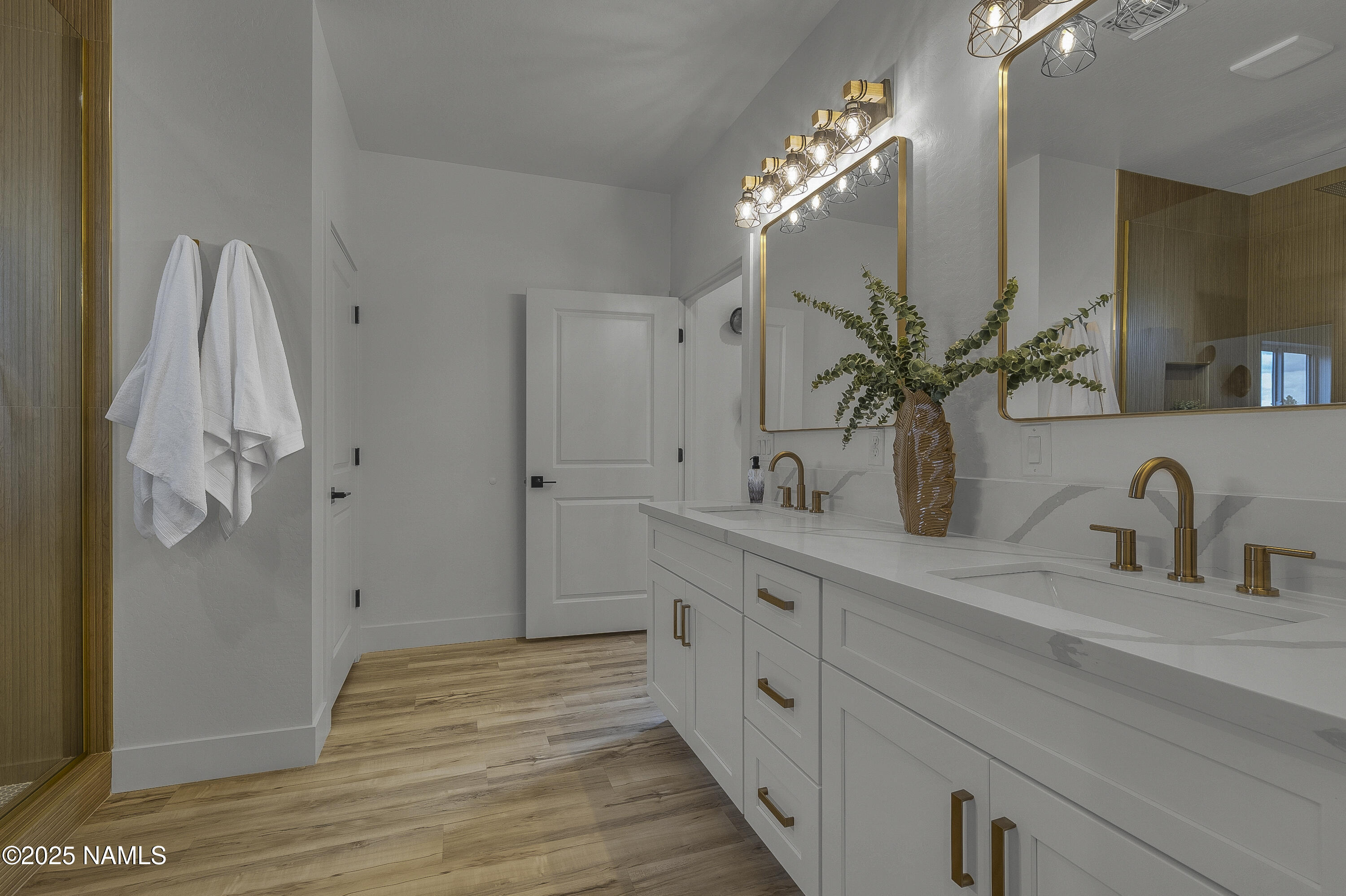 7935 North Red Lake Road Williams, AZ 86046 - Photo 17 of 31 a spacious bathroom with double vanity sink and a mirror