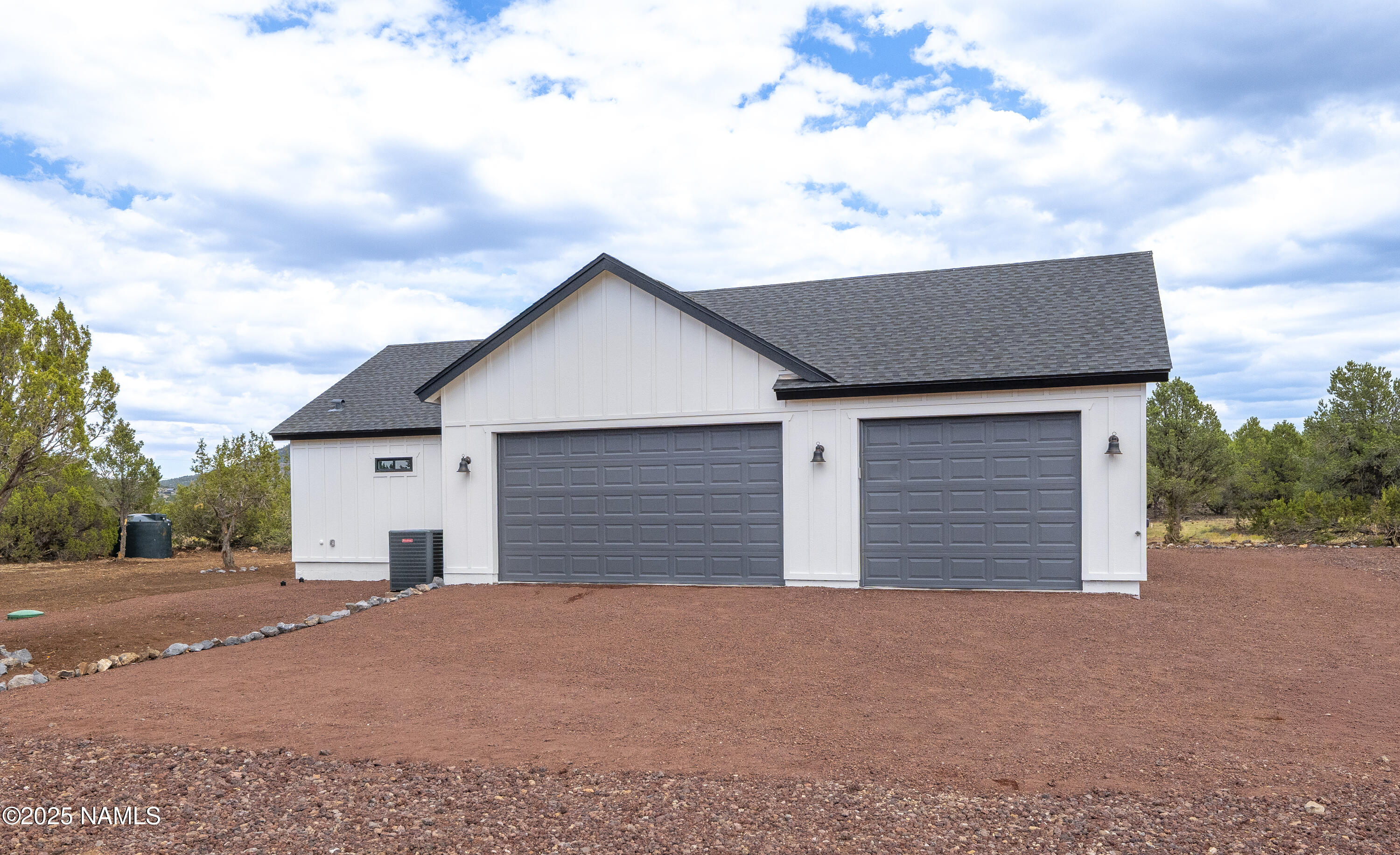 7935 North Red Lake Road Williams, AZ 86046 - Photo 2 of 31 a house with yard in front of it