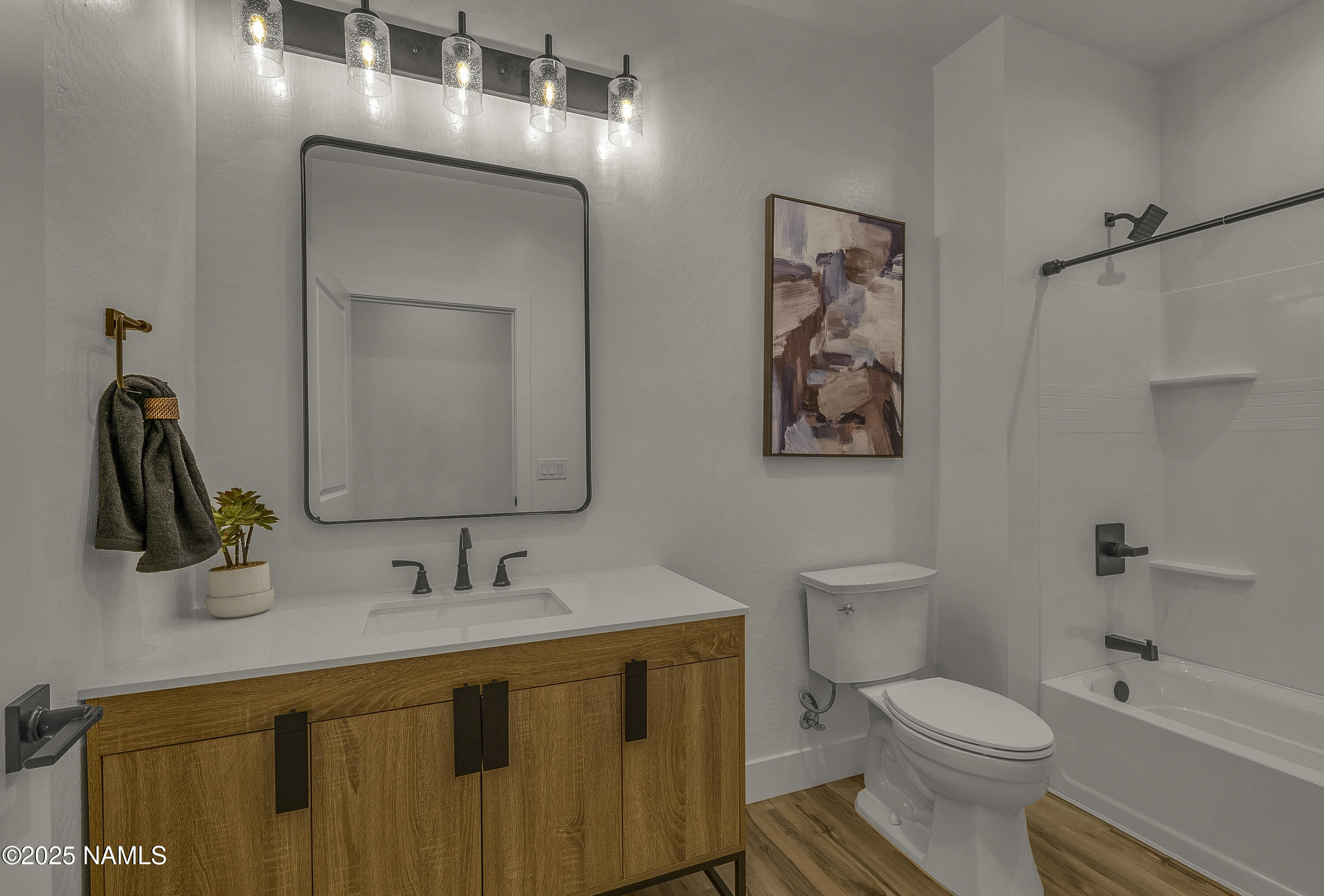 7935 North Red Lake Road Williams, AZ 86046 - Photo 26 of 31 a bathroom with a toilet sink and mirror