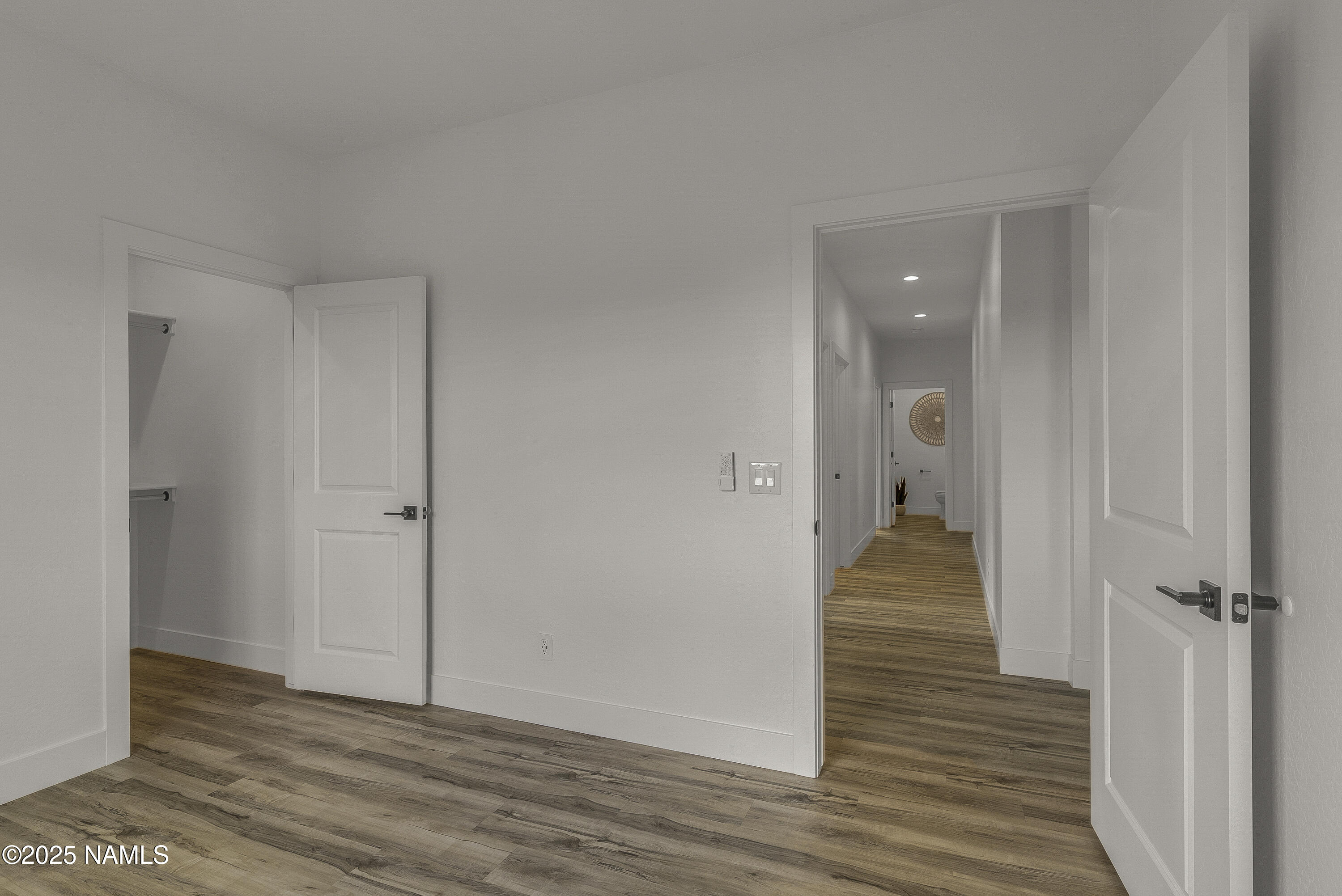 7935 North Red Lake Road Williams, AZ 86046 - Photo 28 of 31 a view of a hallway with wooden floor and staircase