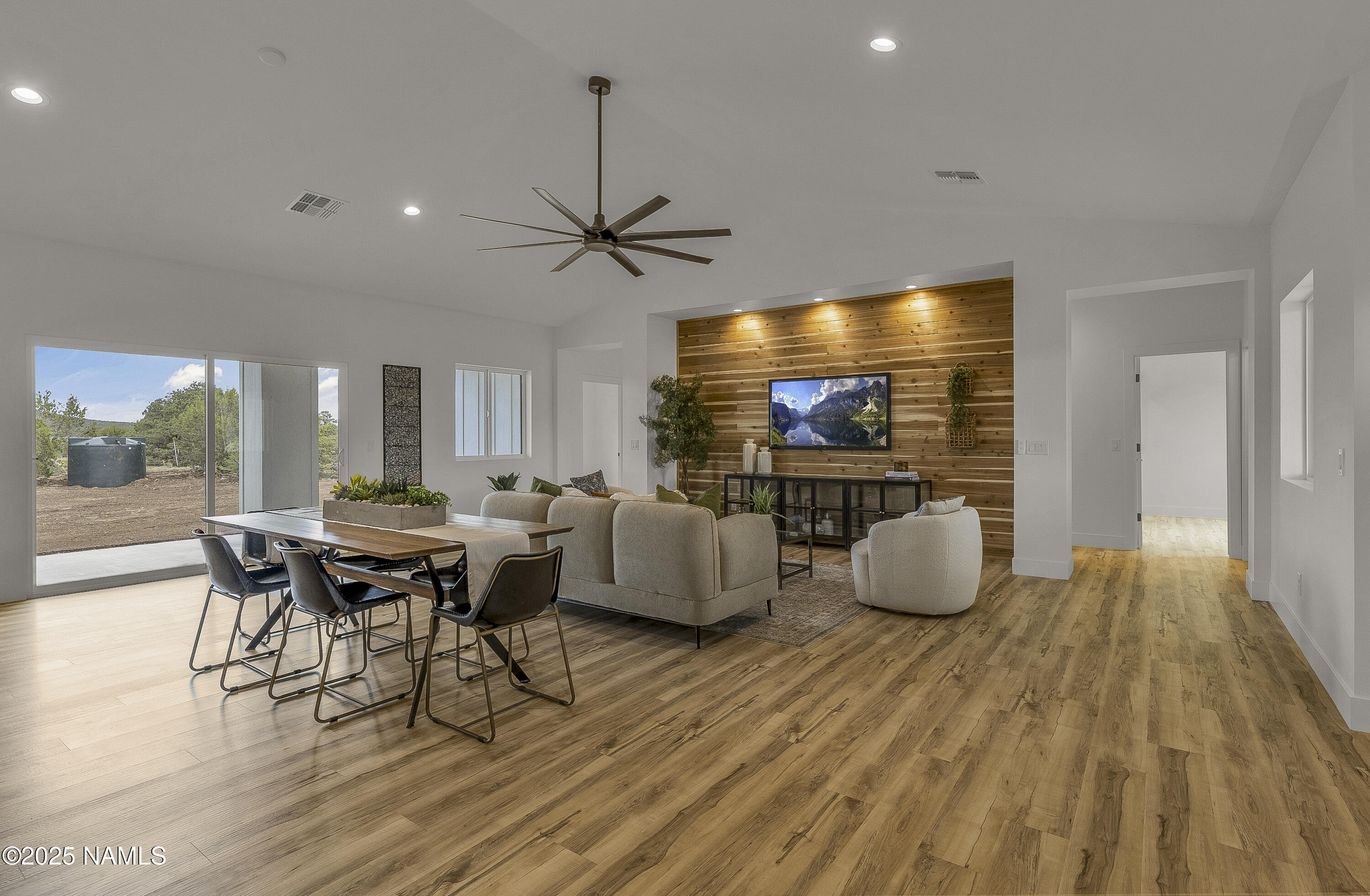 7935 North Red Lake Road Williams, AZ 86046 - Photo 9 of 31 a view of a dining room with furniture and wooden floor