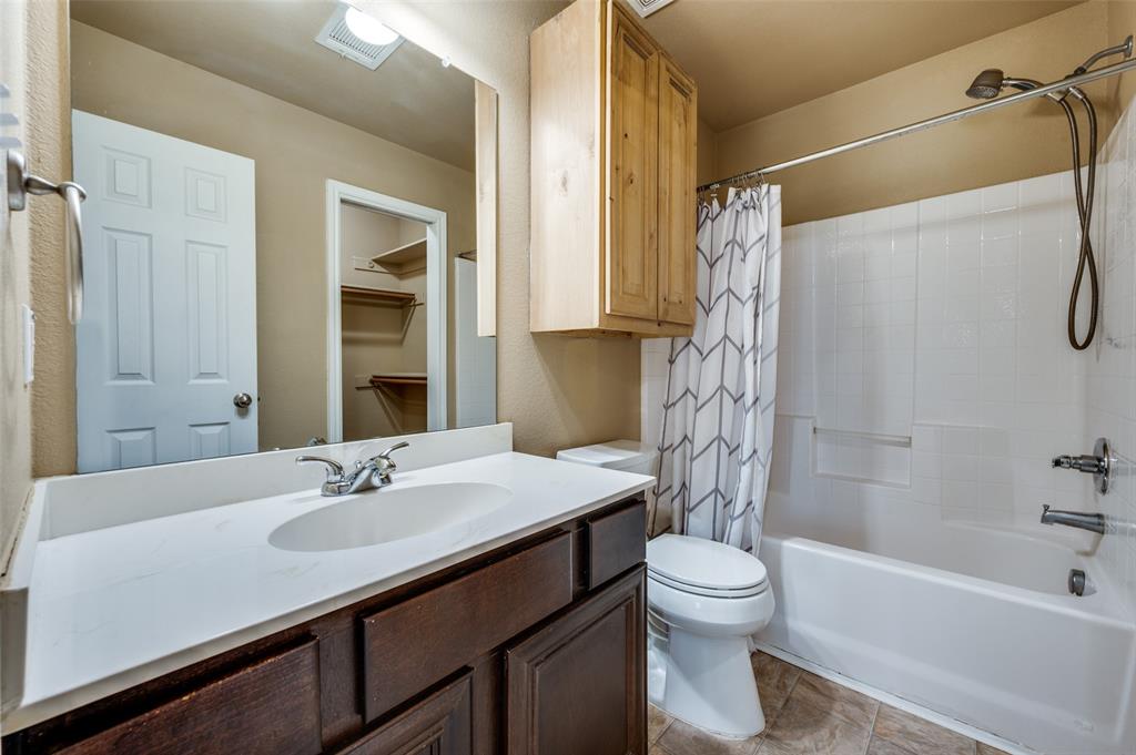 430 Woodgrove Drive, Unit A & B Little Elm, TX 75068 - Photo 11 of 20 a bathroom with a sink a toilet and a bathtub