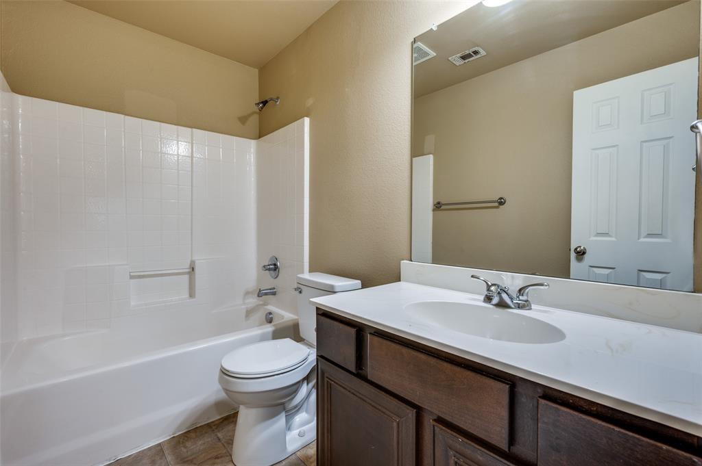 430 Woodgrove Drive, Unit A & B Little Elm, TX 75068 - Photo 13 of 20 a bathroom with a sink a toilet and shower