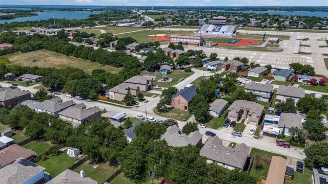 an aerial view of residential houses with outdoor space
